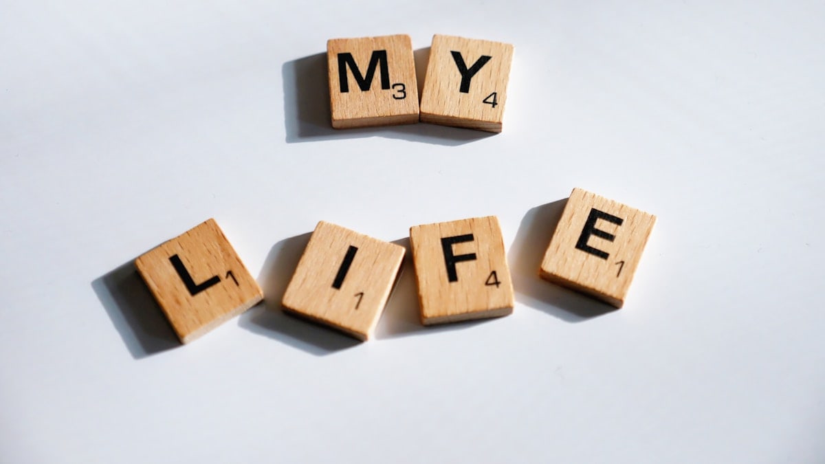scrabbled wooden blocks spelling the word my life